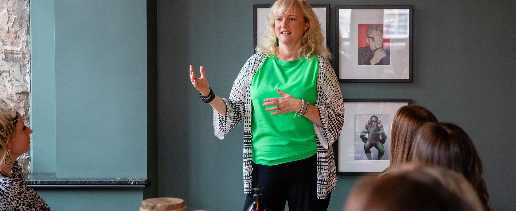 Kerry Sutcliffe mid-conversation with a leadership team